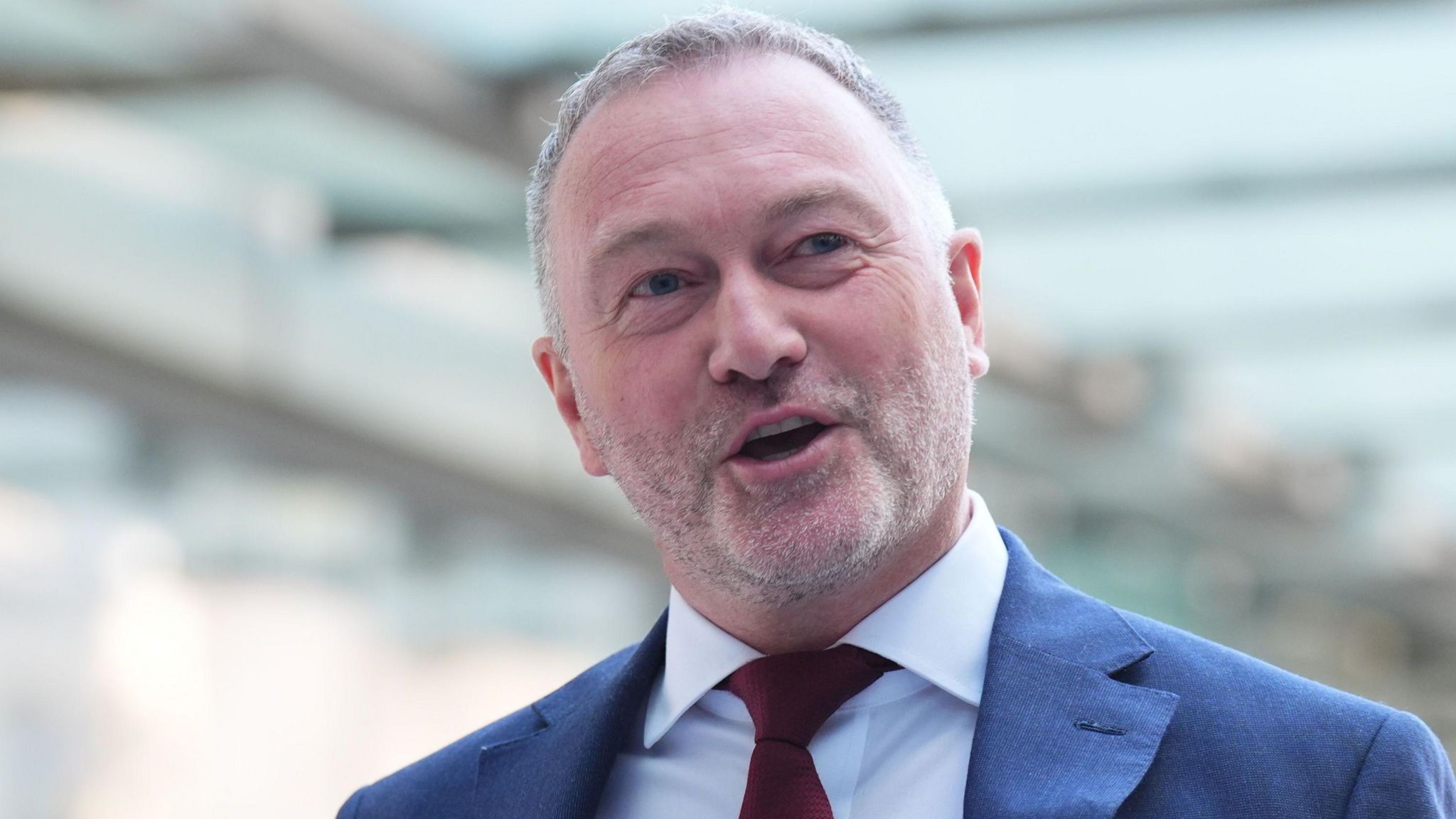 Environment secretary Steve Reed, wearing a red tie and suit, walks in to BBC Broadcasting House in London, to appear on the BBC One current affairs programme, Sunday with Laura Kuenssberg