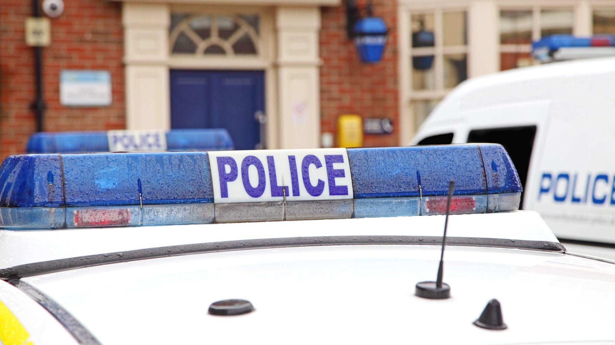 Police car outside a police station