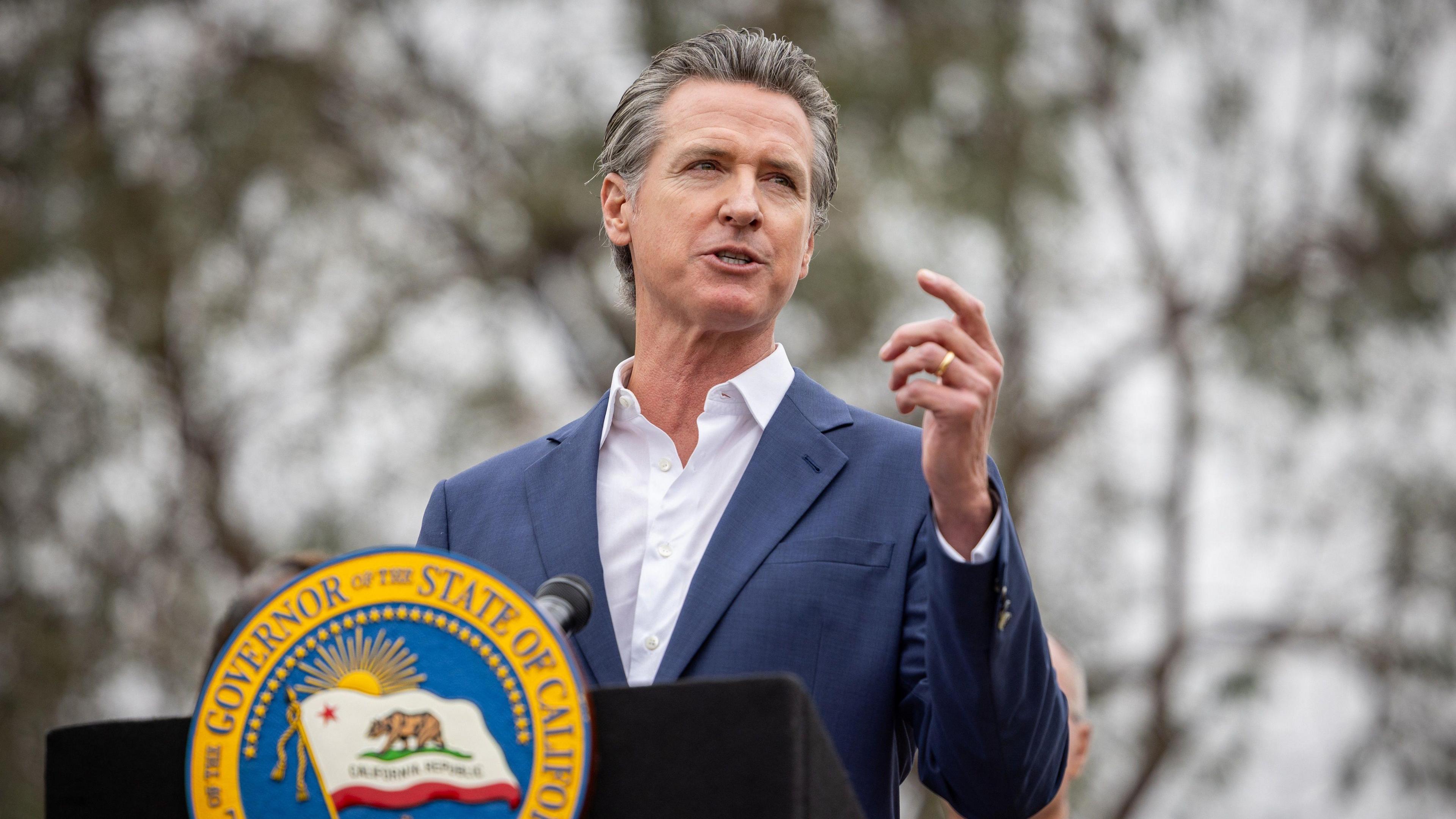 California Governor Gavin Newsom speaking at a press conference.