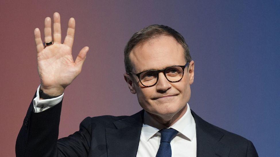 Conservative Party Leadership candidate Tom Tugendhat waves at the crowd during a speech at the final day of the Conservative Party Conference in