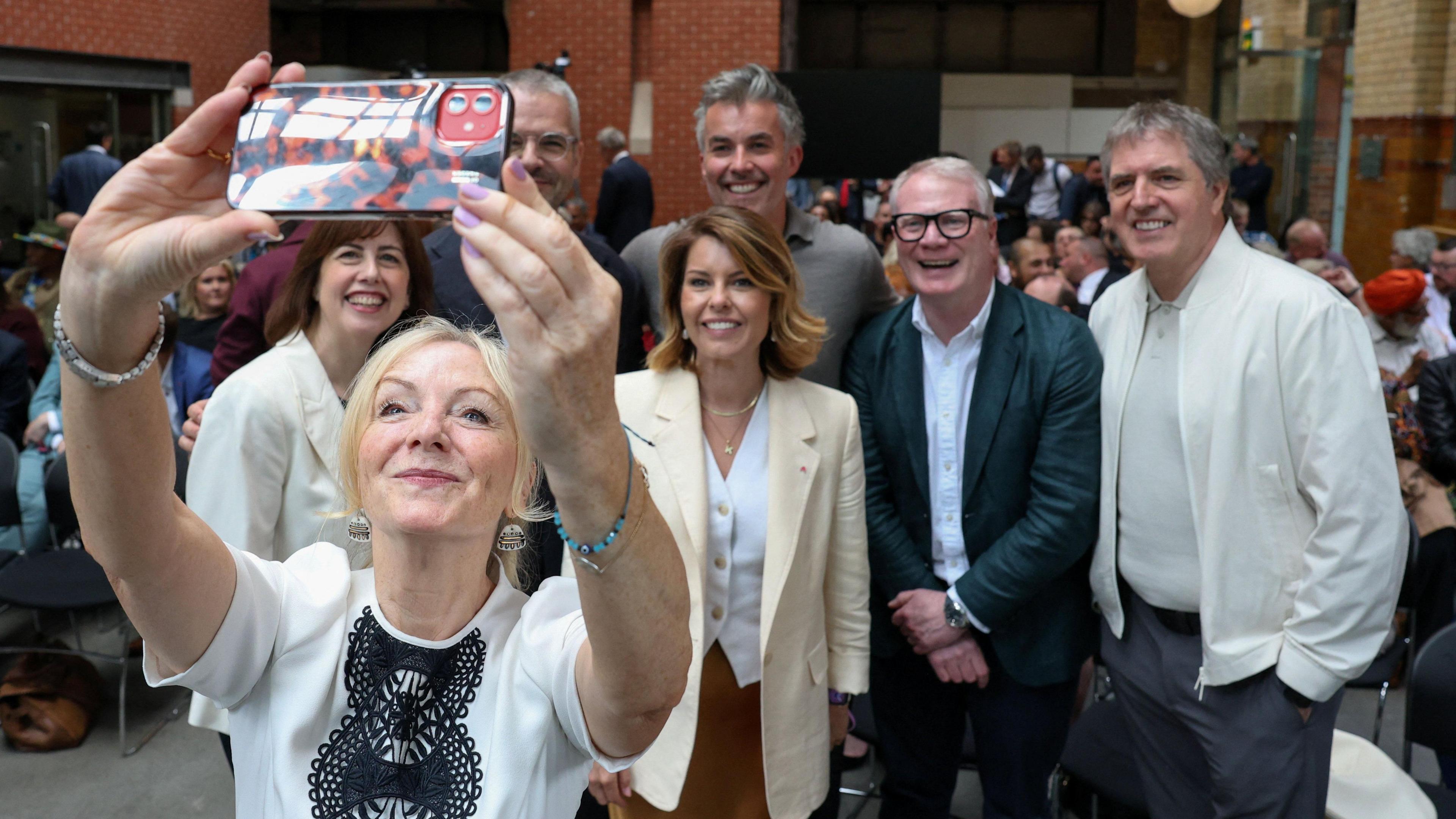 West Yorkshire Mayor Tracy Brabin takes a selfie with Labour Party deputy leader Lucy Powell, North East Mayor Kim McGuinness, West Midlands Mayor Richard Parker, Liverpool City Region Mayor Steve Rotherham, South Yorkshire Mayor Oliver Coppard, and York and North Yorkshire Mayor David Skaith on the day Andy Burnham, British member of parliament (MP) for Makerfield, delivers a speech at the People's History Museum in Manchester, Britain, June 29, 2026.