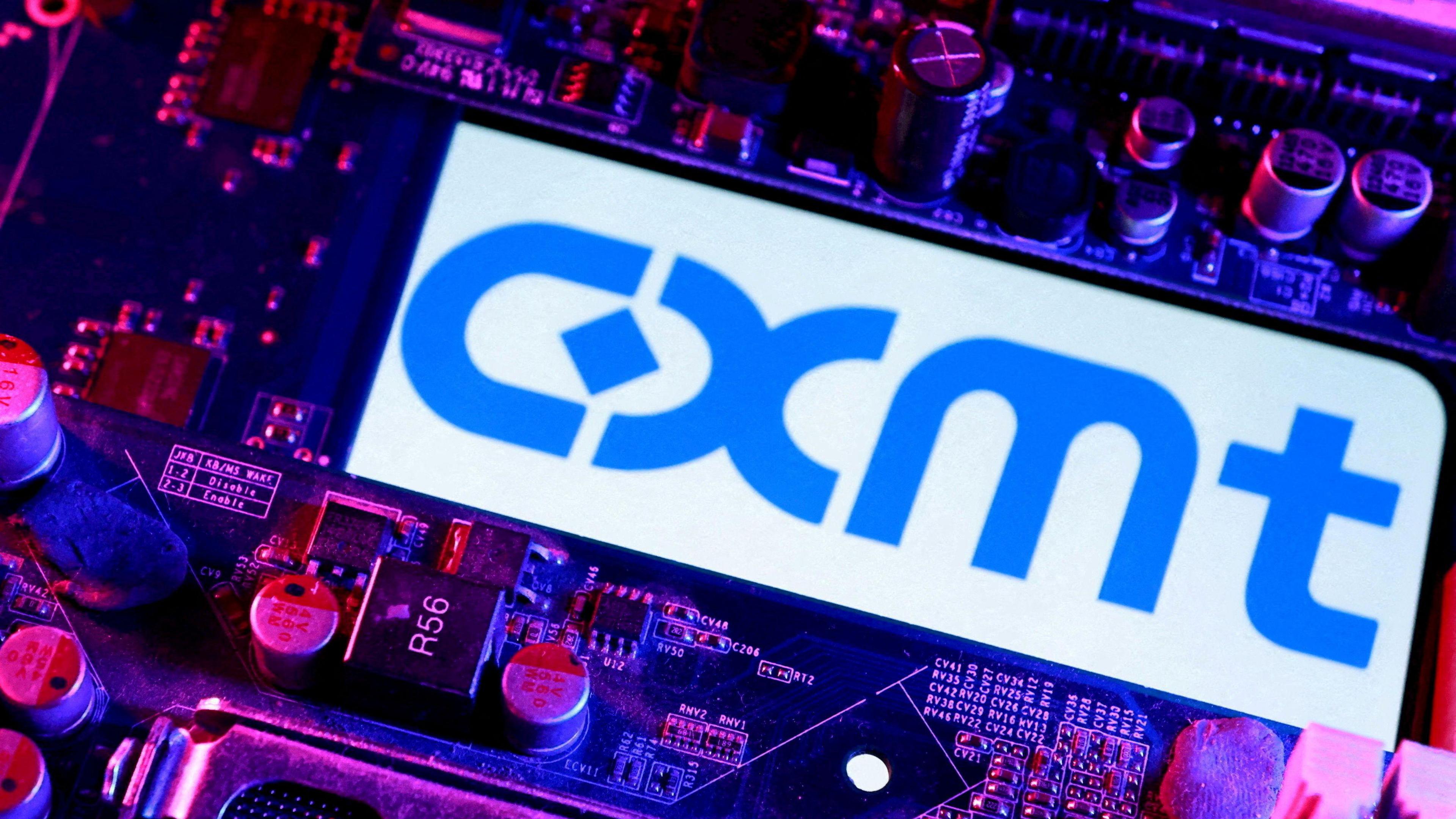  CXMT logo and computer motherboard are seen in this illustration.