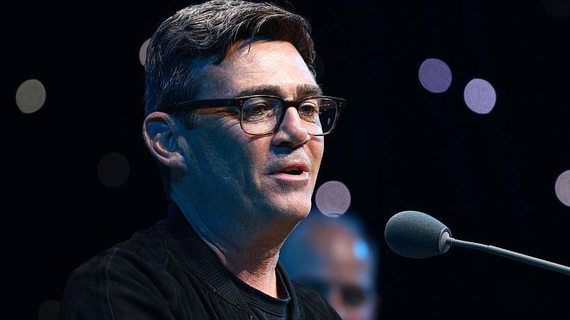 Andy Burnham during the Silver Clef Awards 2026 on 9 July in London. He is wearing a black jacket and top. He is also wearing glasses.