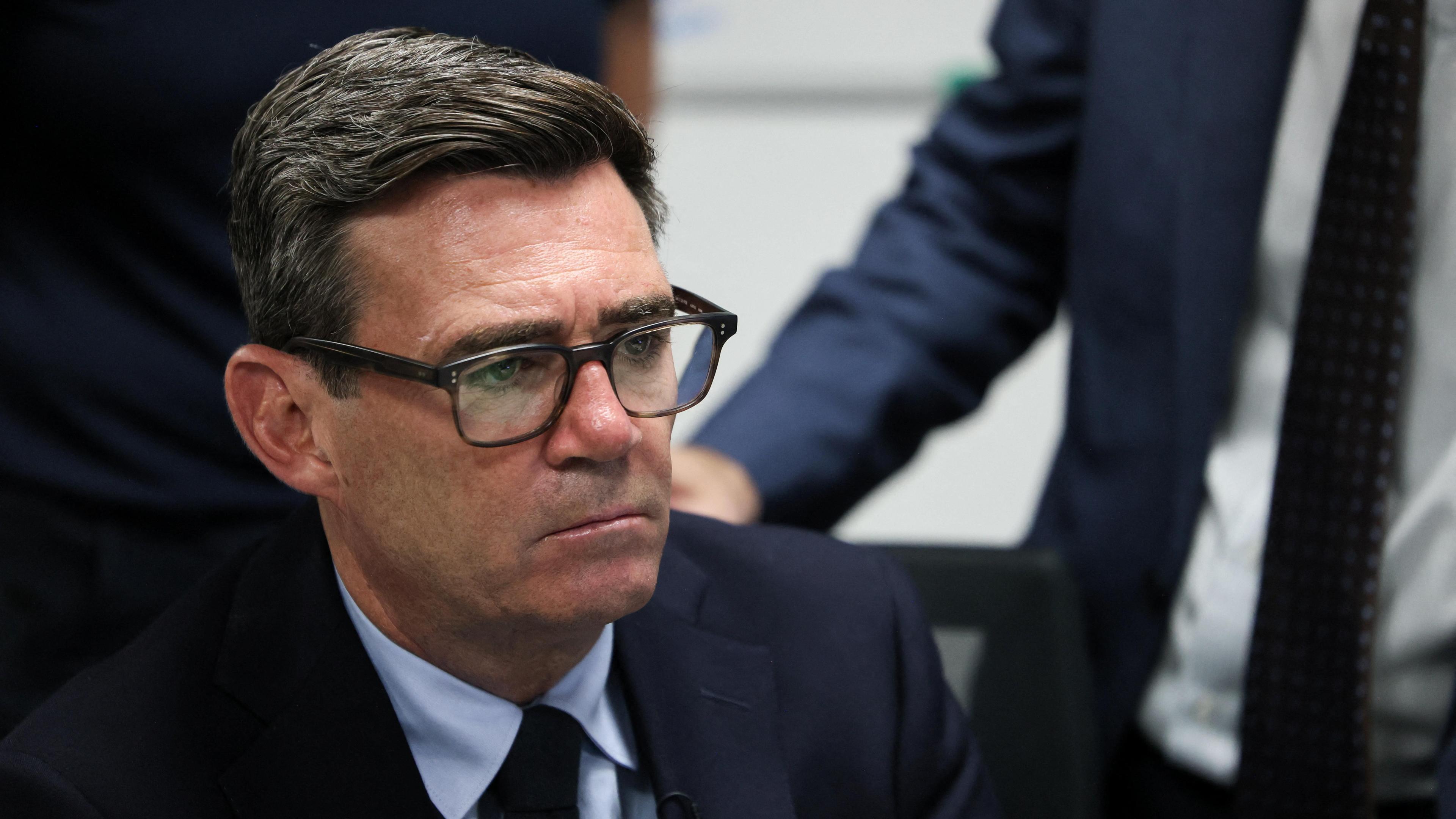 Andy Burnham wearing a serious expression in a suit and tie at a visit to HM Coastguard Maritime Rescue Coordination Centre, in Dover