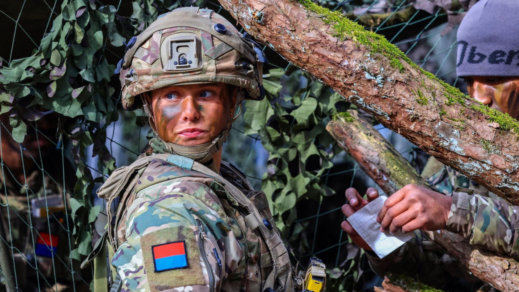 A female British soldier of a gun battery attends the Allied Spirit 25 exercise in Hohenfels, Germany, 12 March 2025