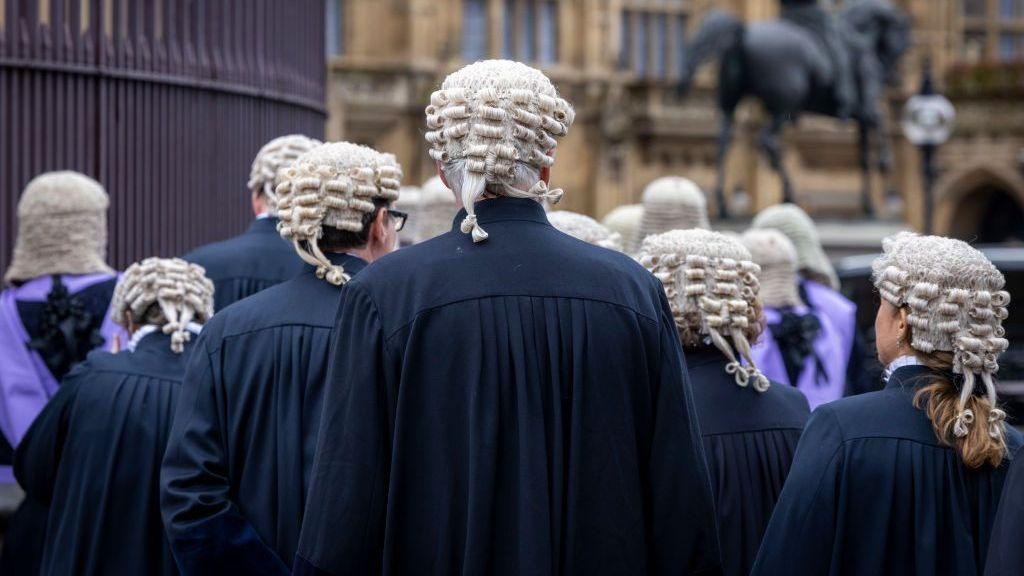 Judges and members of the King's Counsel wearing ceremonial dress leave Westminster Abbey after the traditional annual service in 2024 to mark the start of the new legal year.