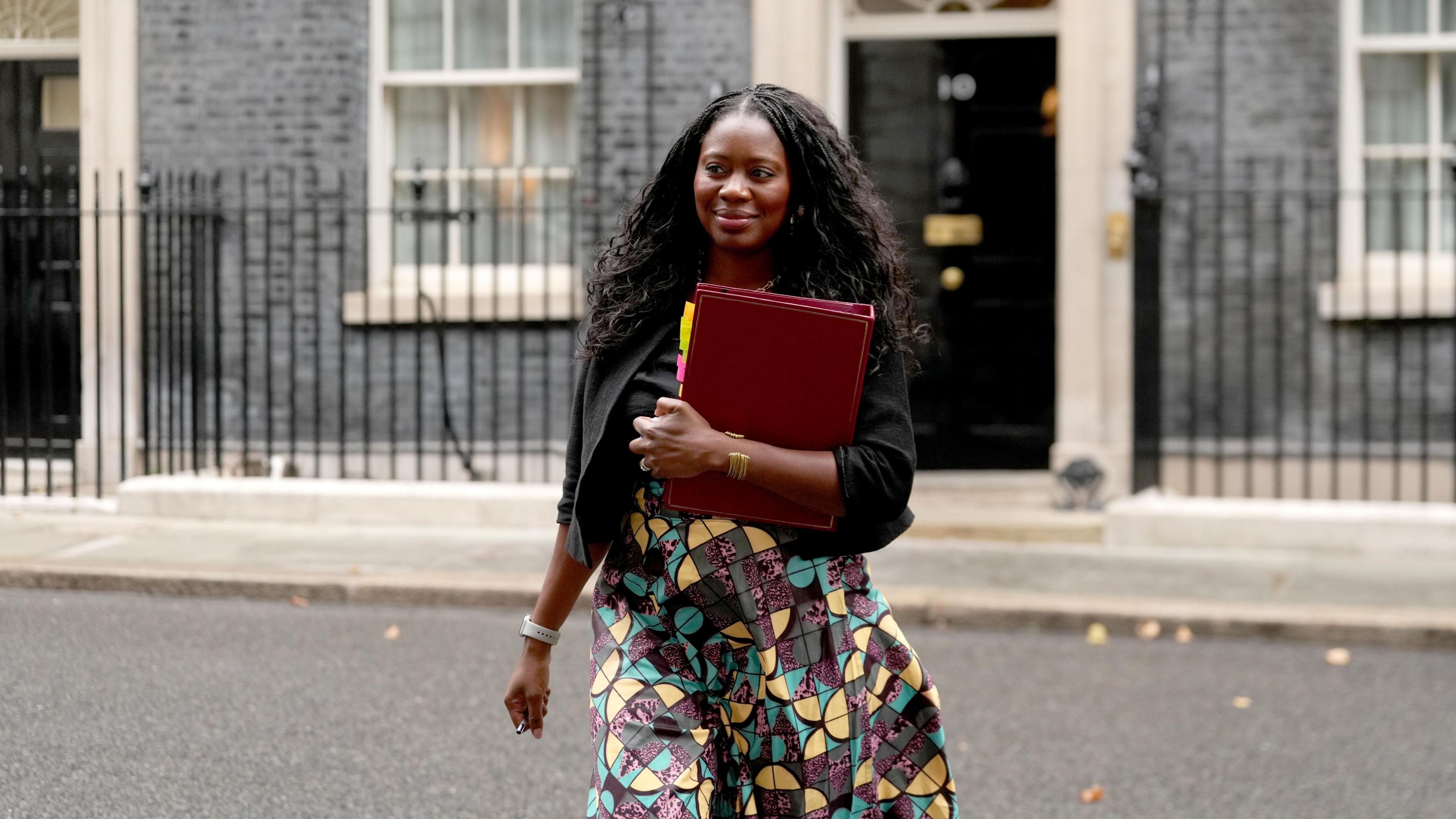 Miatta Fahnbulleh leaving Downing Street carrying a red folder