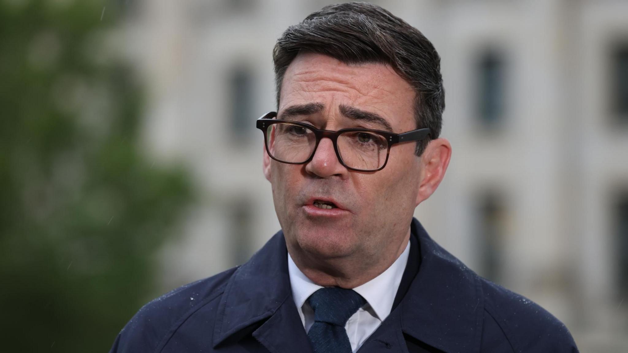 Prime Minister Andy Burnham speaks to the media following his meeting with German Chancellor Friedrich Merz at the Chancellery in Berlin, on 8 October 2026